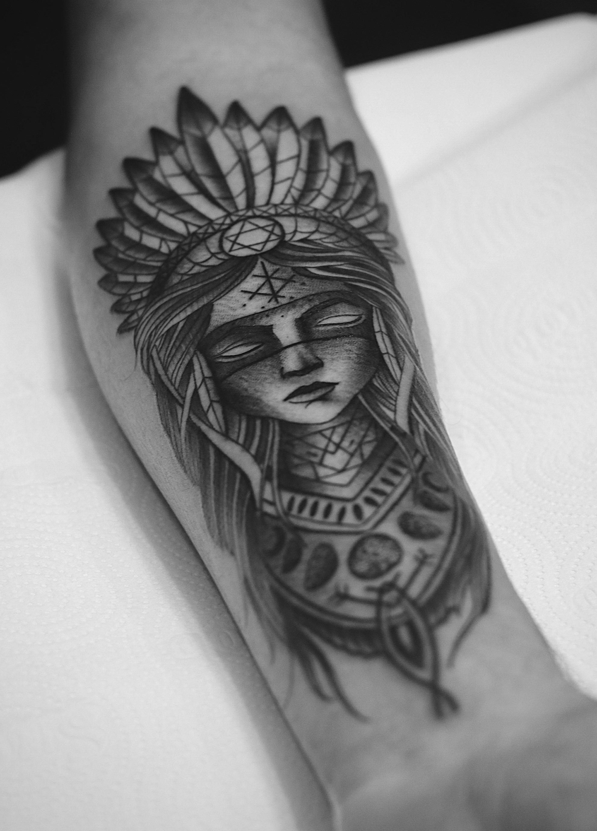Close-up of bold American Traditional tattoos on an arm